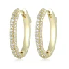 BOUCLES HUGGIES OVALES EN ARGENT/PVD OR SERTIES DE CUBIQUES ZIRCONIAS
