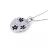 PENDENTIF PLAQUE OVALE AVEC FLEURS SERTI DE CUBIQUES ZIRCONIAS ET DpiÉMAIL